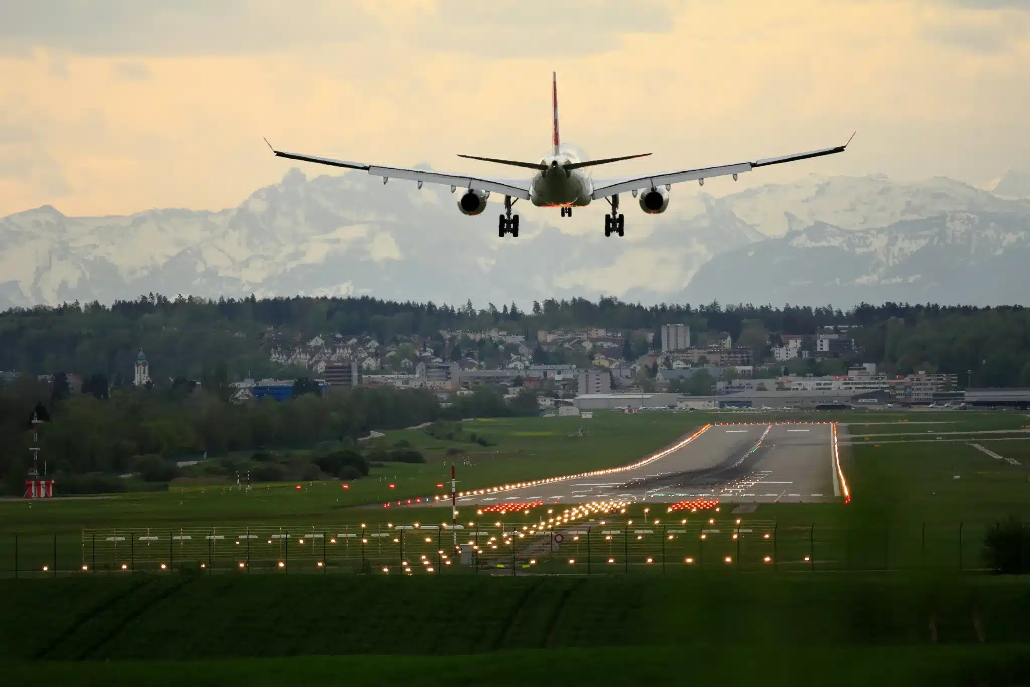 Airplane landing during sunset